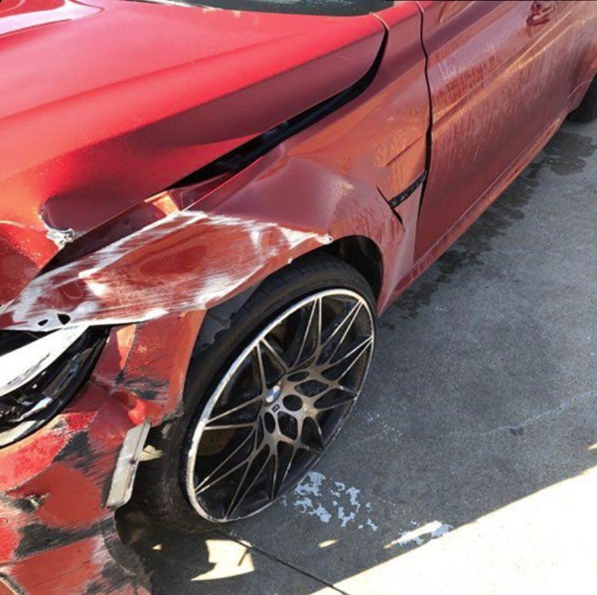 Placeholder showing a damaged vehicle before repair