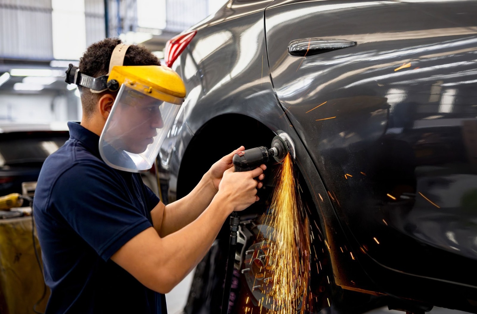 Technician performing a smash repair